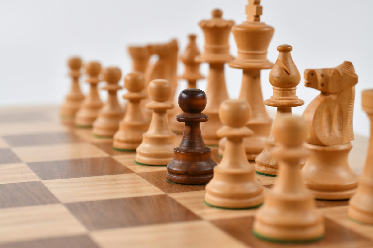 Chessboard game pieces arranged in symmetrical position during algorithmic analysis