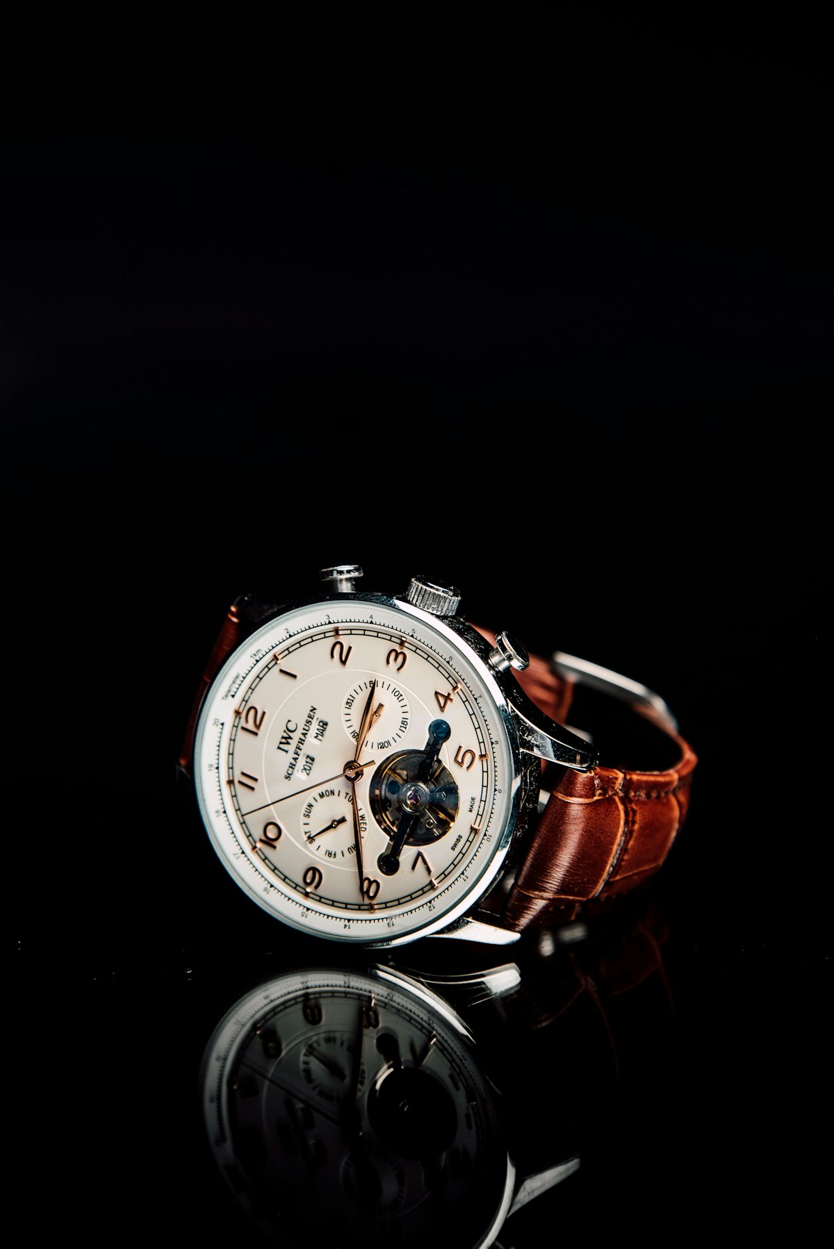 Wristwatch and modern desktop planner displaying numeric time and calendar milestones